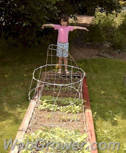 A child showing off her garden.